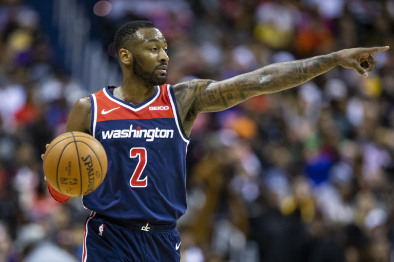 AP Photo,ARCHIVO - En esta foto del 16 de diciembre del 2018, el base de los Wizards de Washington John Wall  driblea en un partido de la NBA.  (AP Foto/Al Drago)