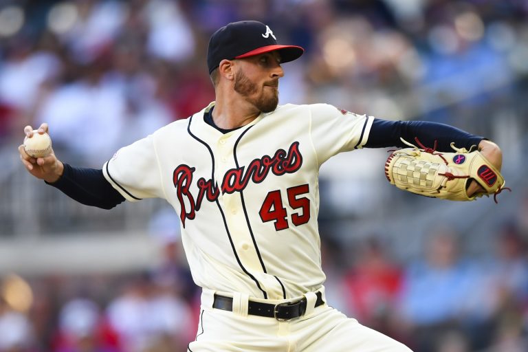 AP Photo,Kevin Gausman lanza por los Bravos de Atlanta en el primer inning del juego ante los Nacionales de Washington, el domingo 21 de julio de 2019, en Atlanta. (AP Foto/John Amis)
