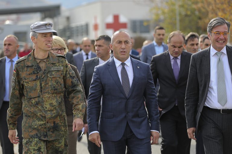 AP Photo,FILE - In this Monday, Nov. 5, 2018 file photo, Kosovo Prime Minister Ramush Haradinaj, center, visits the German KFOR military base in Prizren. Kosovo’s prime minister has resigned from the post after he has been invited to be questioned from a European Union-funded court investigating crimes against ethnic Serbs during and after the 1998-99 independence war with Serbia. Haradinaj said on Friday, July 19, 2019 he had informed the Cabinet of his resignation and urged the country’s president to set a date for an early parliamentary election. (AP Photo/Visar Kryeziu, file)