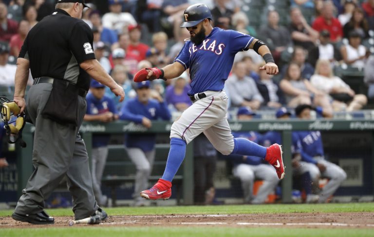 AP Photo, Rougned Odor,El jugador de los Rangers de Texas Rougned Odor anota contra los Marineros de Seattle en el segundo inning de su juego de béisbol, el martes 23 de julio de 2019 en Seattle. (AP Foto/Elaine Thompson)
